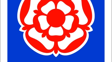 poster of a red flower and blue background and the words 'Visit England'