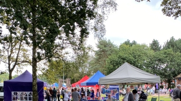 photo of gazebo's in the Castle Grounds with crowds of people