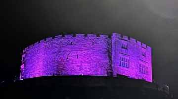 Tamworth Castle in the dark lit up purple